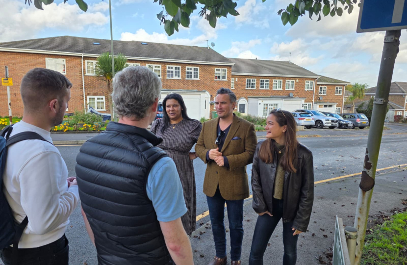 Gemma, Adam and Serena talking to local people